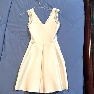 Dressy white v neck  cocktail dress with rhinestone and pearl embellishments